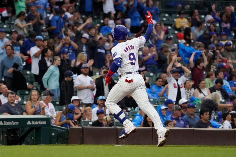 Sep 22, 2024; Chicago, Illinois, USA; Chicago Cubs catcher Miguel Amaya (9) runs the bases after hitting a two-run home run against the Washington Nationals during the fourth inning at Wrigley Field. Mandatory Credit: David Banks-Imagn Images