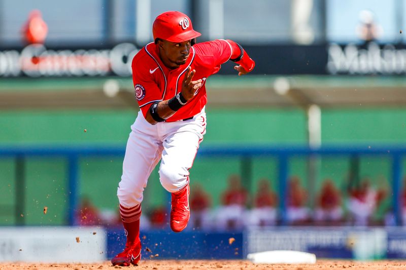 Mar 2, 2023; West Palm Beach, Florida, USA; Washington Nationals center fielder Victor Robles (16) runs toward third base during the second inning against the Miami Marlins at The Ballpark of the Palm Beaches. Mandatory Credit: Sam Navarro-USA TODAY Sports