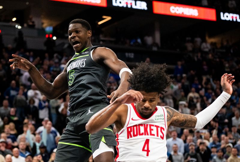 MINNEAPOLIS, MINNESOTA - APRIL 2: Anthony Edwards #5 of the Minnesota Timberwolves dunks the ball as Jalen Green #4 of the Houston Rockets defends him in the fourth quarter of the game at Target Center on April 2, 2024 in Minneapolis, Minnesota. NOTE TO USER: User expressly acknowledges and agrees that, by downloading and or using this photograph, User is consenting to the terms and conditions of the Getty Images License Agreement. (Photo by Stephen Maturen/Getty Images)