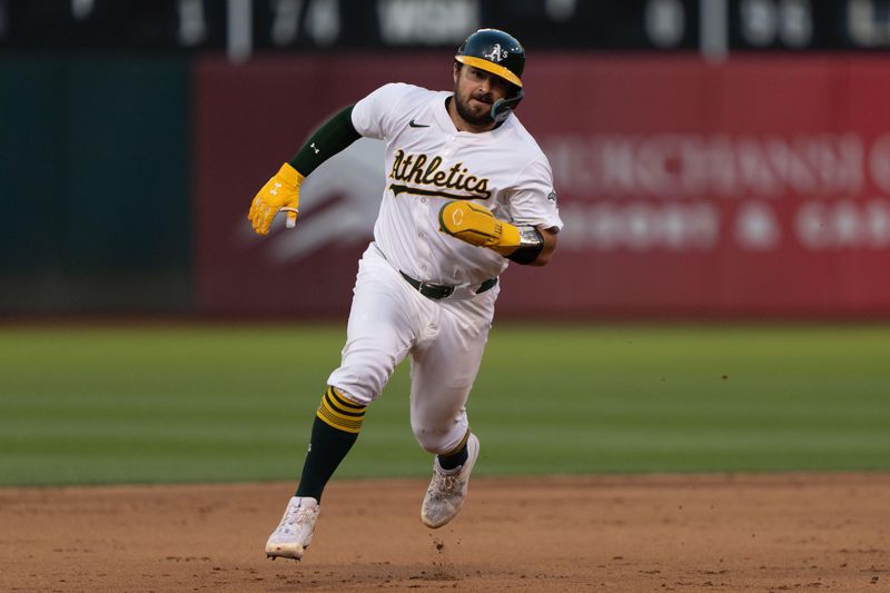 Jul 23, 2024; Oakland, California, USA;  Oakland Athletics catcher Shea Langeliers (23) runs toward third base during the fifth inning against the Houston Astros at Oakland-Alameda County Coliseum. Mandatory Credit: Stan Szeto-USA TODAY Sports