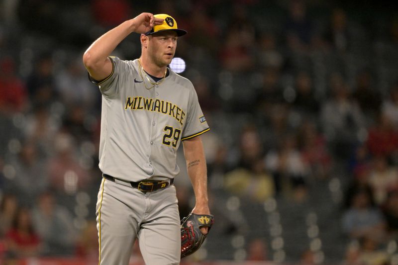 Jun 19, 2024; Anaheim, California, USA;  Milwaukee Brewers relief pitcher Trevor Megill (29) reacts after the final out of the ninth inning earning a save against the Los Angeles Angels at Angel Stadium. Mandatory Credit: Jayne Kamin-Oncea-USA TODAY Sports