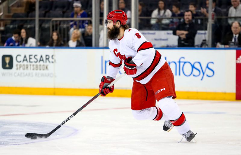 Jan 2, 2024; New York, New York, USA; Carolina Hurricanes defenseman Brent Burns (8) skates with the puck against the New York Rangers during the first period at Madison Square Garden. Mandatory Credit: Danny Wild-USA TODAY Sports