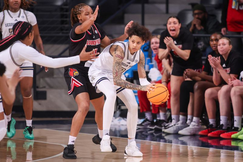 Feb 26, 2026; Atlanta, Georgia, USA; Georgia Tech Yellow Jackets guard Brianna Turnage (0) is defended by Louisville Cardinals forward MacKenly Randolph (4) in the second quarter at McCamish Pavilion. Mandatory Credit: Brett Davis-Imagn Images