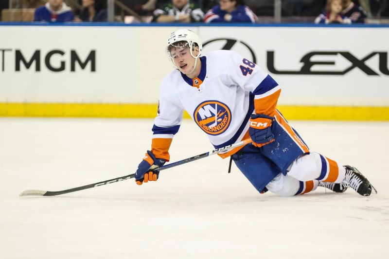 Sep 26, 2023; New York, New York, USA;  New York Islanders forward Matthew Maggio (48) attempts to get up after an injury in the first period against the New York Rangers at Madison Square Garden. Mandatory Credit: Wendell Cruz-USA TODAY Sports