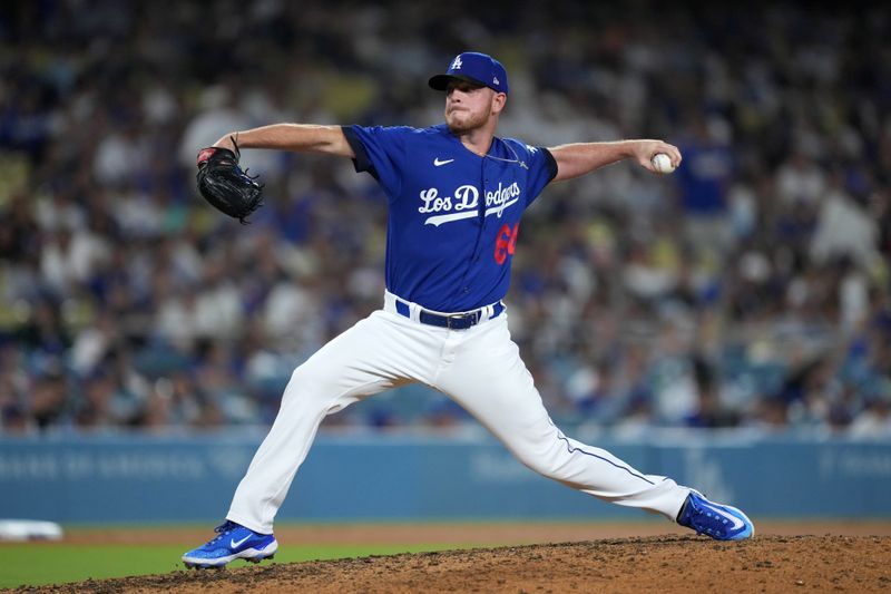 Jul 25, 2023; Los Angeles, California, USA; Los Angeles Dodgers relief pitcher Caleb Ferguson (64) throws against the Toronto Blue Jays in the eighth inning at Dodger Stadium. Mandatory Credit: Kirby Lee-USA TODAY Sports