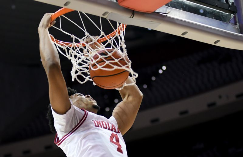 Mar 4, 2026; Bloomington, Indiana, USA; Indiana Hoosiers forward Sam Alexis (4) dunks the ball against the Minnesota Golden Gophers during the first half at Simon Skjodt Assembly Hall. Mandatory Credit: Robert Goddin-Imagn Images