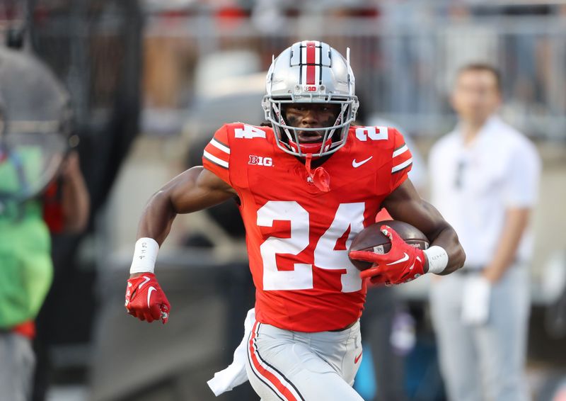 Sep 16, 2023; Columbus, Ohio, USA; Ohio State Buckeyes cornerback Jermaine Mathews Jr. (24) returns an interception for the touchdown during the fourth quarter against the Western Kentucky Hilltoppers at Ohio Stadium. Mandatory Credit: Joseph Maiorana-USA TODAY Sports