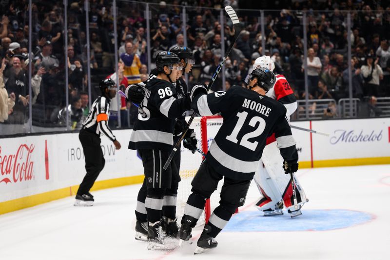 Oct 18, 2025; Los Angeles, California, USA; Los Angeles Kings left wing Andrei Kuzmenko (96) is greeted by teammates after scoring during the second period against the Carolina Hurricanes at Crypto.com Arena. Mandatory Credit: William Liang-Imagn Images
