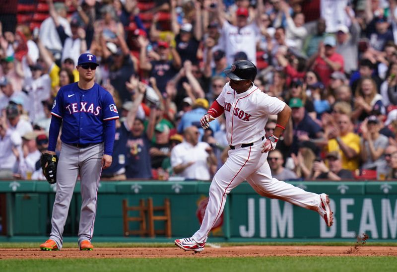 May 8, 2025; Boston, Massachusetts, USA; Boston Red Sox designated hitter Rafael Devers (11) hits a home run against the Texas Rangers in the seventh inning at Fenway Park. Mandatory Credit: David Butler II-Imagn Images