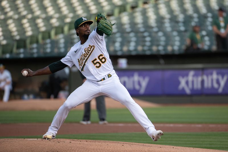 Aug 22, 2023; Oakland, California, USA; Oakland Athletics relief pitcher Dany Jimenez (56) throws a pitch during the first inning against the Kansas City Royals at Oakland-Alameda County Coliseum. Mandatory Credit: Ed Szczepanski-USA TODAY Sports