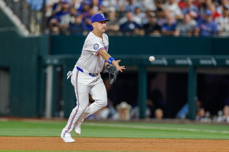 Jul 23, 2024; Arlington, Texas, USA; Texas Rangers first base Nathaniel Lowe (30) tosses over to first base during the sixth inning against the Chicago White Sox at Globe Life Field. Mandatory Credit: Andrew Dieb-USA TODAY Sports