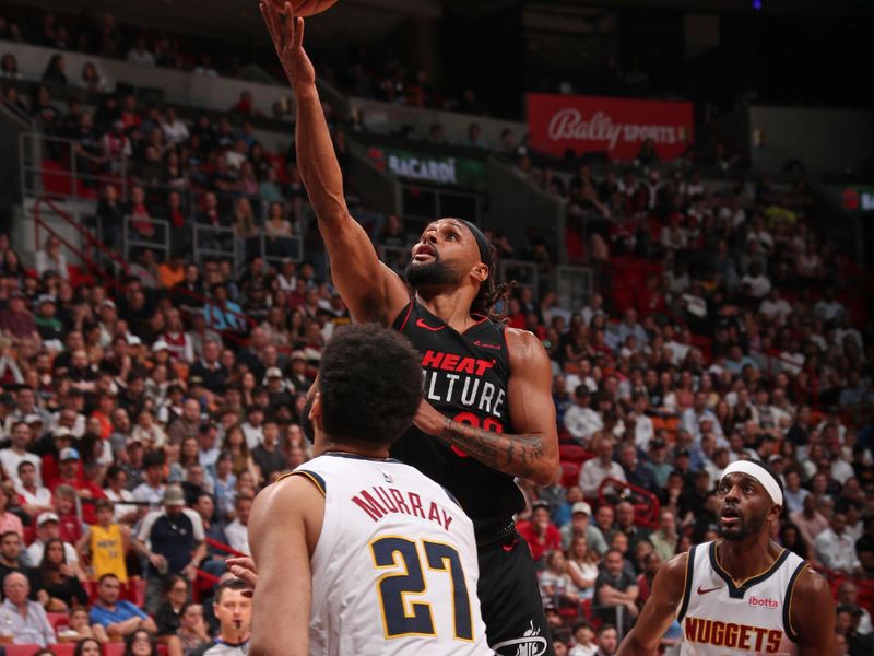 MIAMI, FL - MARCH 13: Patty Mills #88 of the Miami Heat  shoots the ball during the game against the Denver Nuggets  on March 13, 2024 at Kaseya Center in Miami, Florida. NOTE TO USER: User expressly acknowledges and agrees that, by downloading and or using this Photograph, user is consenting to the terms and conditions of the Getty Images License Agreement. Mandatory Copyright Notice: Copyright 2024 NBAE (Photo by Issac Baldizon/NBAE via Getty Images)