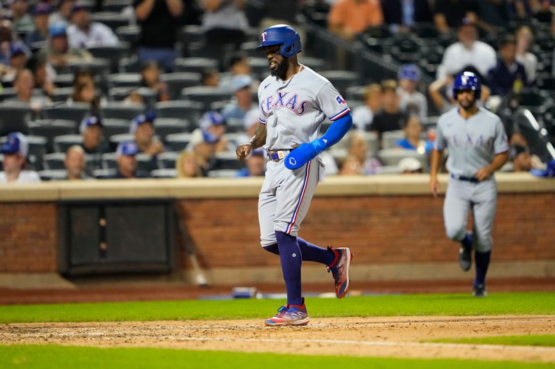 Aug 30, 2023; New York City, New York, USA; Texas Rangers right fielder Adolis Garcia (53) scores a run on Texas Rangers catcher Jonah Heim (not pictured) RBI single against the New York Mets during the eighth inning at Citi Field. Mandatory Credit: Gregory Fisher-USA TODAY Sports