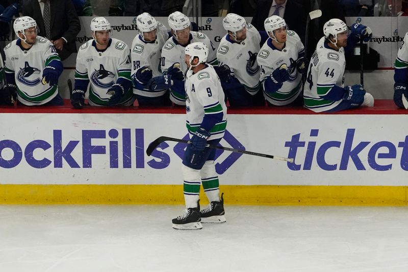 Oct 22, 2024; Chicago, Illinois, USA; Vancouver Canucks left wing Danton Heinen (20) celebrates his goal against the Chicago Blackhawks during the first period at United Center. Mandatory Credit: David Banks-Imagn Images