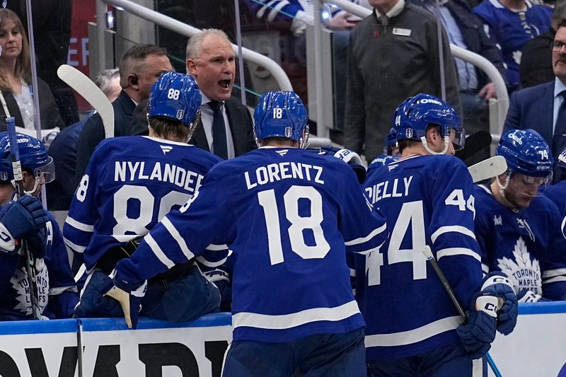 May 5, 2025; Toronto, Ontario, CAN; Toronto Maple Leafs head coach Craig Berube talks to his players after a Florida Panthers goal during the third period of game one of the second round of the 2025 Stanley Cup Playoffs at Scotiabank Arena. Mandatory Credit: John E. Sokolowski-Imagn Images