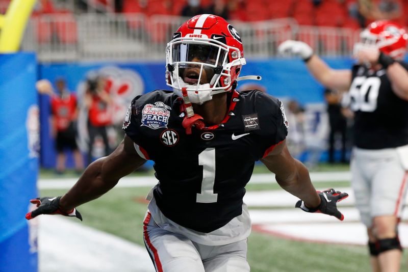 Jan 1, 2021; Atlanta, GA, USA; Georgia wide receiver George Pickens (1) celebrates after scoring a touchdown during the first half of the Peach Bowl NCAA college football game between Georgia and Cincinnati at Mercedes-Benz Stadium in Atlanta., on Saturday, Jan. 1, 2021. Mandatory Credit: Joshua L. Jones-USA TODAY NETWORK