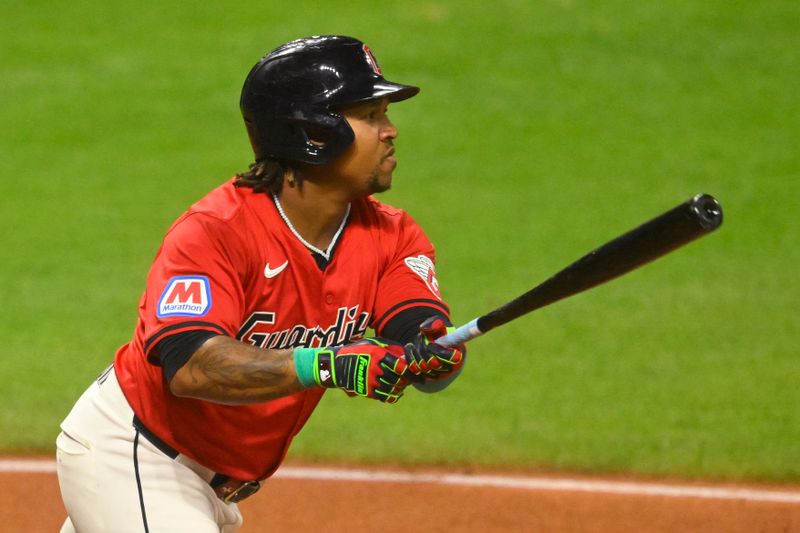 Sep 24, 2024; Cleveland, Ohio, USA; Cleveland Guardians third baseman Jose Ramirez (11) singles in the fifth inning against the Cincinnati Reds at Progressive Field. Mandatory Credit: David Richard-Imagn Images