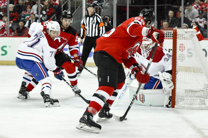 Feb 24, 2024; Newark, New Jersey, USA; New Jersey Devils left wing Erik Haula (56) shoots the puck as Montreal Canadiens goaltender Jake Allen (34) defends the net during the second period at Prudential Center. Mandatory Credit: John Jones-USA TODAY Sports