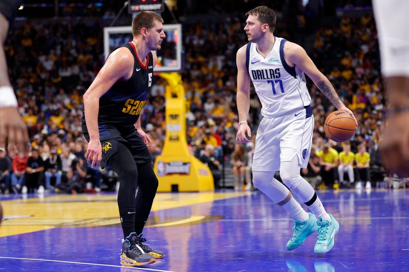 DENVER, COLORADO - NOVEMBER 03:  Nikola Jokic #15 of the Denver Nuggets defends Luka Doncic #77 of the Dallas Mavericks during the fourth quarter during the NBA In-Season Tournament at Ball Arena on November 3, 2023 in Denver, Colorado. NOTE TO USER: User expressly acknowledges and agrees that, by downloading and or using this photograph, User is consenting to the terms and conditions of the Getty Images License Agreement. (Photo by C. Morgan Engel/Getty Images)