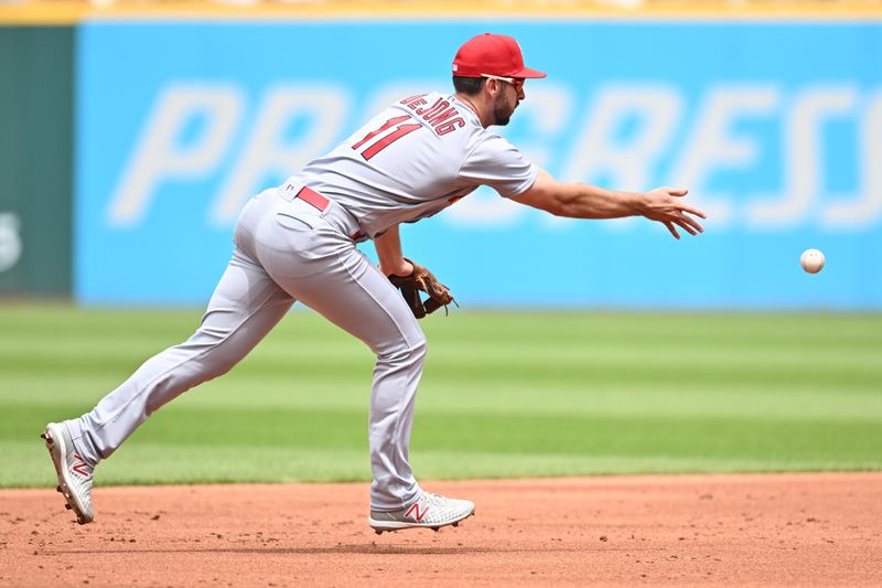 May 28, 2023; Cleveland, Ohio, USA; St. Louis Cardinals shortstop Paul DeJong (11) flips the ball to second base on a play in the second inning against the Cleveland Guardians at Progressive Field. Mandatory Credit: Ken Blaze-USA TODAY Sports