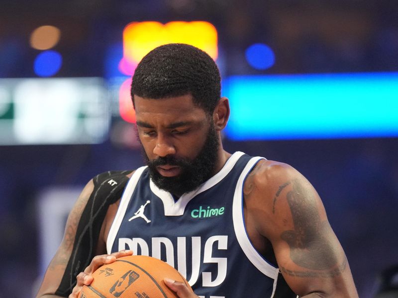 DALLAS, TX - JUNE 14: Kyrie Irving #11 of the Dallas Mavericks looks on before the game against the Boston Celtics during Game 4 of the 2024 NBA Finals on June 14, 2024 at the American Airlines Center in Dallas, Texas. NOTE TO USER: User expressly acknowledges and agrees that, by downloading and or using this photograph, User is consenting to the terms and conditions of the Getty Images License Agreement. Mandatory Copyright Notice: Copyright 2024 NBAE (Photo by Jesse D. Garrabrant/NBAE via Getty Images)