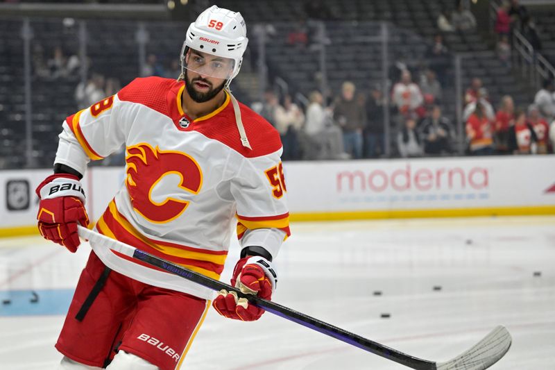 Apr 11, 2024; Los Angeles, California, USA;  Calgary Flames defenseman Oliver Kylington (58) warms up prior to the game against the Los Angeles Kings at Crypto.com Arena. Mandatory Credit: Jayne Kamin-Oncea-USA TODAY Sports