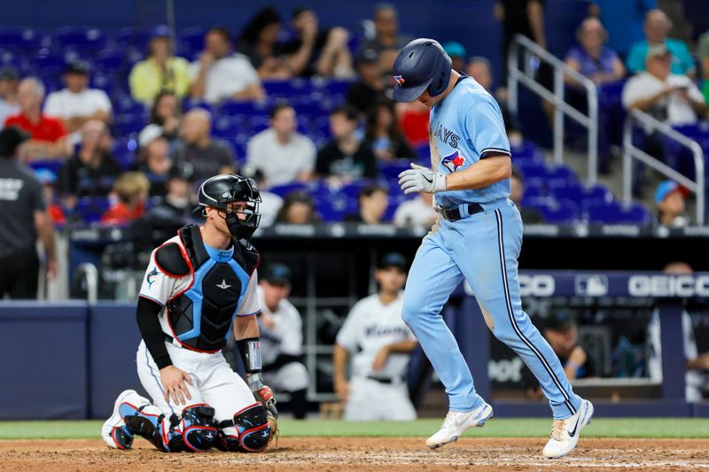 Jun 21, 2023; Miami, Florida, USA; Toronto Blue Jays third baseman Matt Chapman (26) scores after hitting a home run against the Miami Marlins during the eighth inning at loanDepot Park. Mandatory Credit: Sam Navarro-USA TODAY Sports