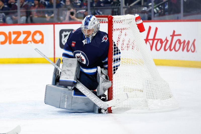 Feb 27, 2024; Winnipeg, Manitoba, CAN; Winnipeg Jets goalie Laurent Boissoit (39) looks for the puck against the St. Louis Blues during the first period at Canada Life Centre. Mandatory Credit: Terrence Lee-USA TODAY Sports