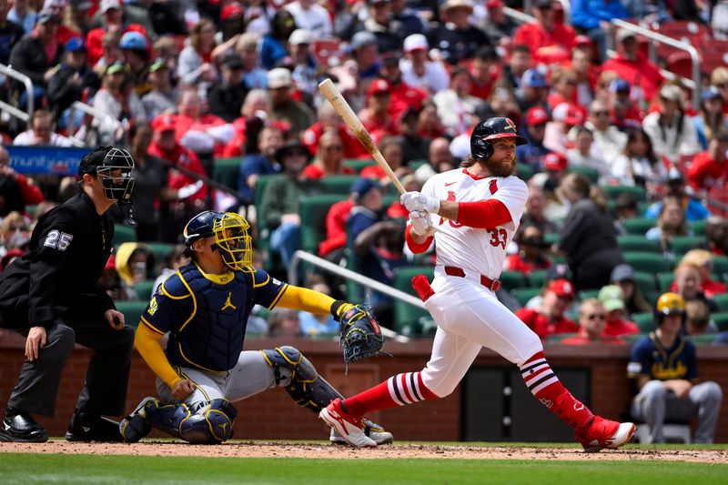 Apr 27, 2025; St. Louis, Missouri, USA;  St. Louis Cardinals left fielder Brendan Donovan (33) hits a one run single against the Milwaukee Brewers during the fifth inning at Busch Stadium. Mandatory Credit: Jeff Curry-Imagn Images