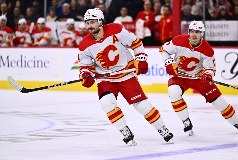 Jan 6, 2024; Philadelphia, Pennsylvania, USA; Calgary Flames defenseman Rasmus Andersson (4) in action against the Philadelphia Flyers in the first period at Wells Fargo Center. Mandatory Credit: Kyle Ross-USA TODAY Sports