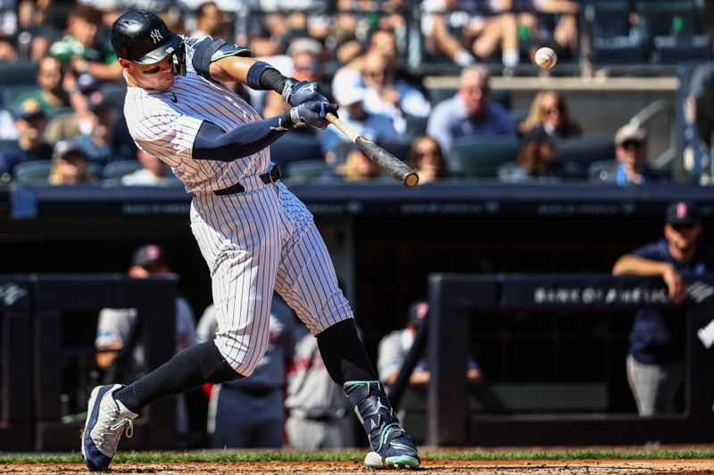 Sep 15, 2024; Bronx, New York, USA;  New York Yankees center fielder Aaron Judge (99) hits a two-run home run in the third inning against the Boston Red Sox at Yankee Stadium. Mandatory Credit: Wendell Cruz-Imagn Images