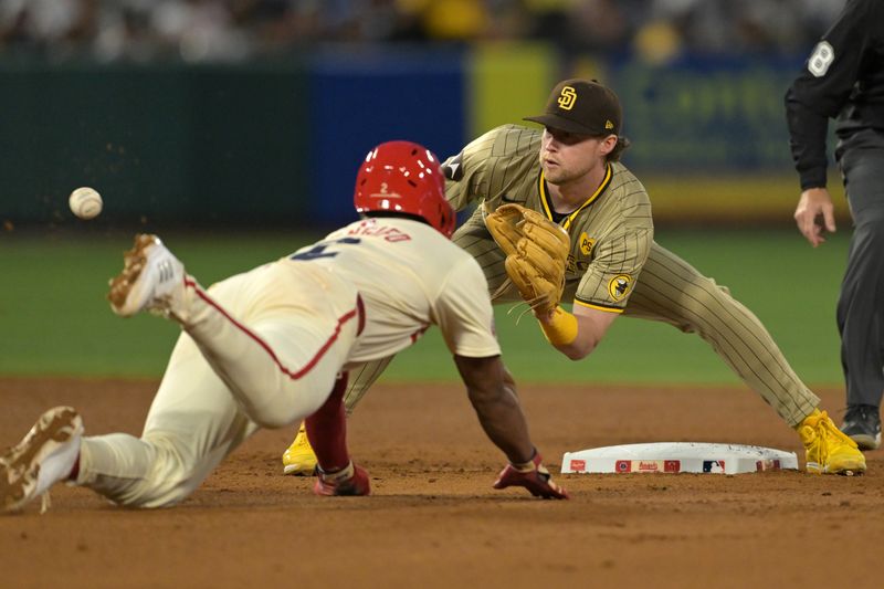 Jun 5, 2024; Anaheim, California, USA;  Los Angeles Angels second baseman Luis Rengifo (2) is tagged out by San Diego Padres first baseman Jake Cronenworth (9) on a stolen base attempt in the seventh inning at Angel Stadium. Mandatory Credit: Jayne Kamin-Oncea-USA TODAY Sports