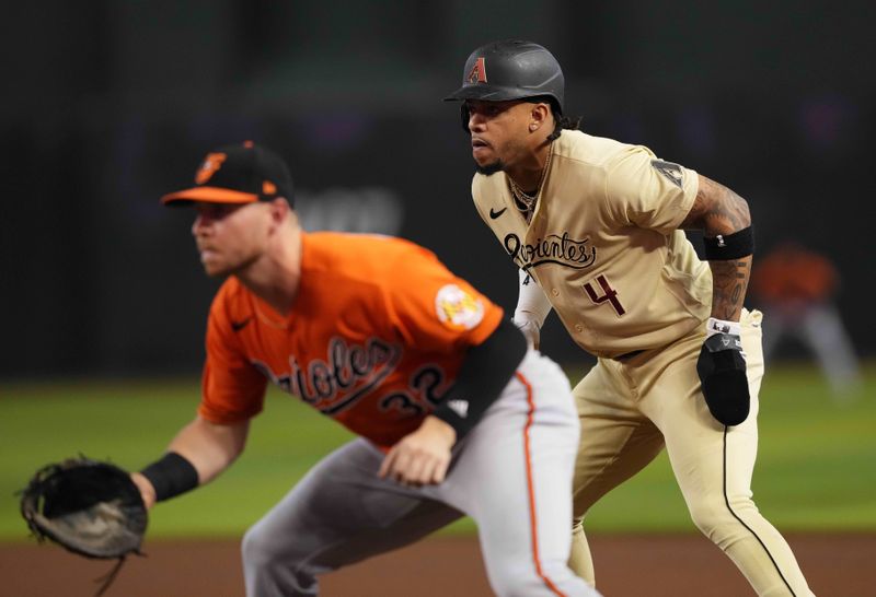 Sep 2, 2023; Phoenix, Arizona, USA; Arizona Diamondbacks second baseman Ketel Marte (4) leads off first base as Baltimore Orioles first baseman Ryan O'Hearn (32) covers the bag during the first inning at Chase Field. Mandatory Credit: Joe Camporeale-USA TODAY Sports