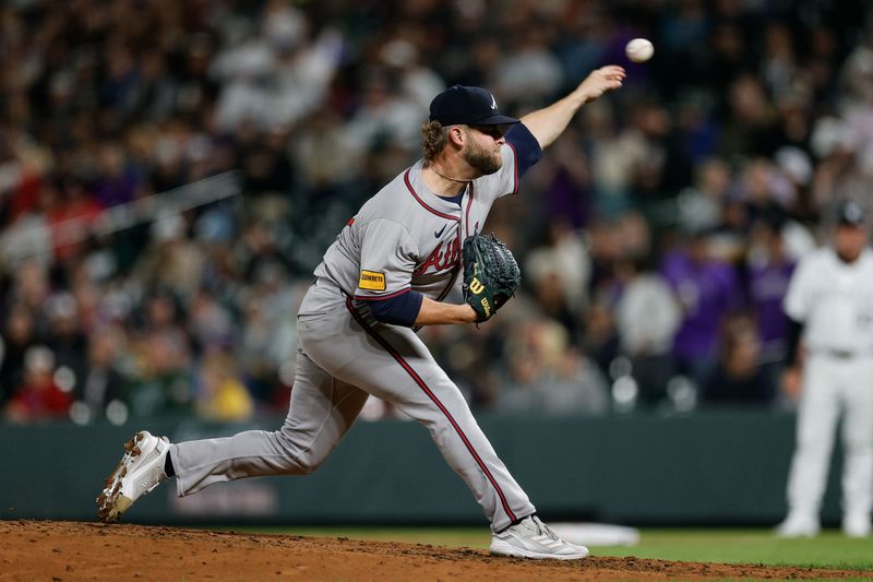 Aug 9, 2024; Denver, Colorado, USA; Atlanta Braves relief pitcher A.J. Minter (33) pitches in the seventh inning against the Colorado Rockies at Coors Field. Mandatory Credit: Isaiah J. Downing-USA TODAY Sports