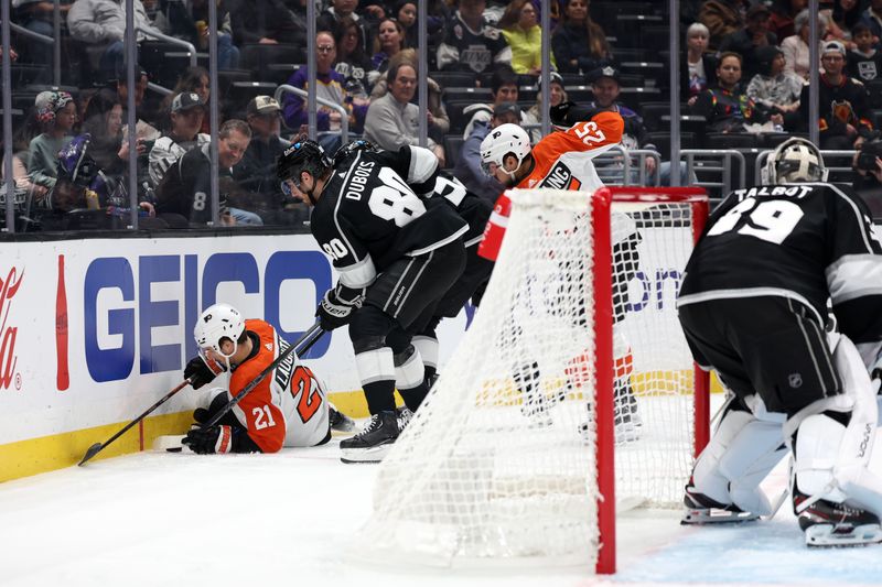 Nov 11, 2023; Los Angeles, California, USA;  Philadelphia Flyers center Scott Laughton (21) battles for the puck against Los Angeles Kings left wing Pierre-Luc Dubois (80) during the first period at Crypto.com Arena. Mandatory Credit: Kiyoshi Mio-USA TODAY Sports