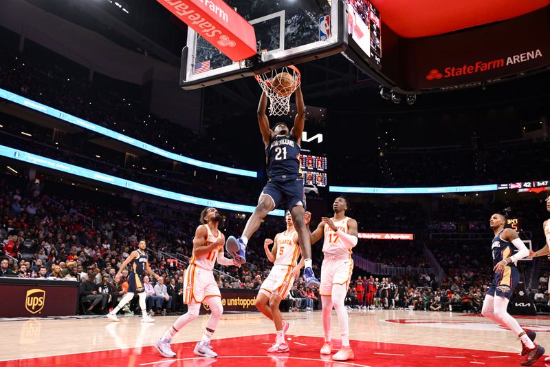 ATLANTA, GA - DECEMBER 2: Yves Missi #21 of the New Orleans Pelicans dunks the ball during the game against the Atlanta Hawks on December 2, 2024 at State Farm Arena in Atlanta, Georgia.  NOTE TO USER: User expressly acknowledges and agrees that, by downloading and/or using this Photograph, user is consenting to the terms and conditions of the Getty Images License Agreement. Mandatory Copyright Notice: Copyright 2024 NBAE (Photo by Adam Hagy/NBAE via Getty Images)