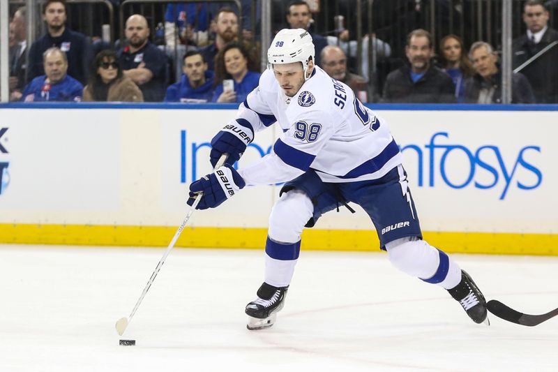 Feb 7, 2024; New York, New York, USA; Tampa Bay Lightning defenseman Mikhail Sergachev (98) chases the puck in the first period against the New York Rangers at Madison Square Garden. Mandatory Credit: Wendell Cruz-USA TODAY Sports