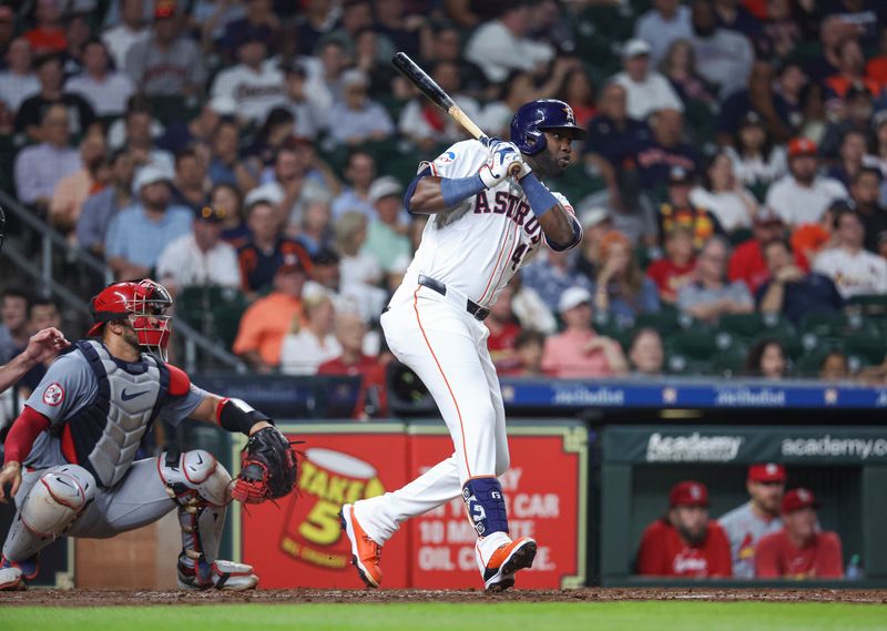 Jun 4, 2024; Houston, Texas, USA; Houston Astros left fielder Yordan Alvarez (44) hits a single during the third inning against the St. Louis Cardinals at Minute Maid Park. Mandatory Credit: Troy Taormina-USA TODAY Sports