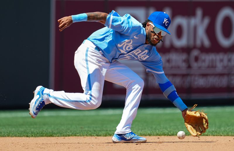 Jul 30, 2023; Kansas City, Missouri, USA; Kansas City Royals third baseman Maikel Garcia (11) fields a ground ball during the fifth inning against the Minnesota Twins at Kauffman Stadium. Mandatory Credit: Jay Biggerstaff-USA TODAY Sports