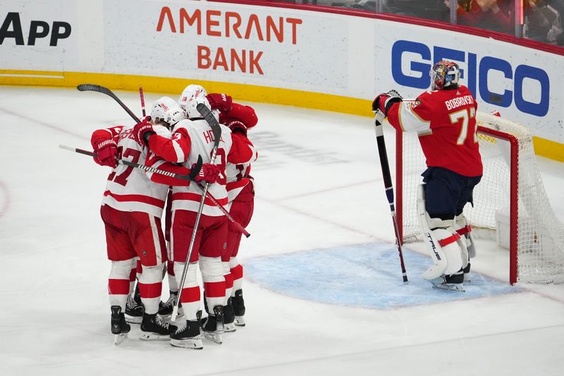 Jan 17, 2024; Sunrise, Florida, USA; Detroit Red Wings teammates celebrate the goal of center Robby Fabbri (14) during the third period on Florida Panthers goaltender Sergei Bobrovsky (72)at Amerant Bank Arena. Mandatory Credit: Jasen Vinlove-USA TODAY Sports