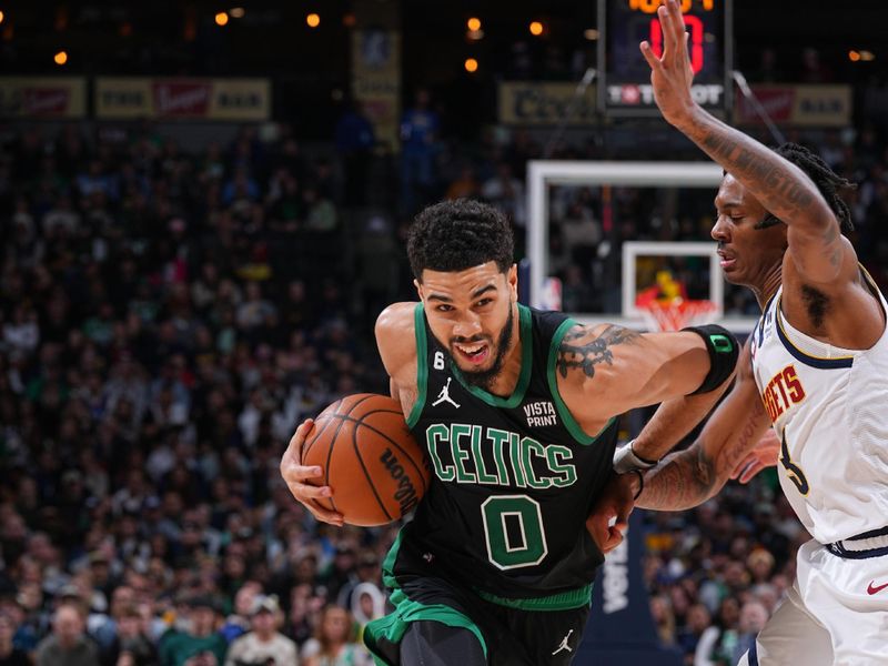 DENVER, CO - JANUARY 1: Jayson Tatum #0 of the Boston Celtics drives to the basket on January 1, 2023 at the Ball Arena in Denver, Colorado. NOTE TO USER: User expressly acknowledges and agrees that, by downloading and/or using this Photograph, user is consenting to the terms and conditions of the Getty Images License Agreement. Mandatory Copyright Notice: Copyright 2022 NBAE (Photo by Bart Young/NBAE via Getty Images)