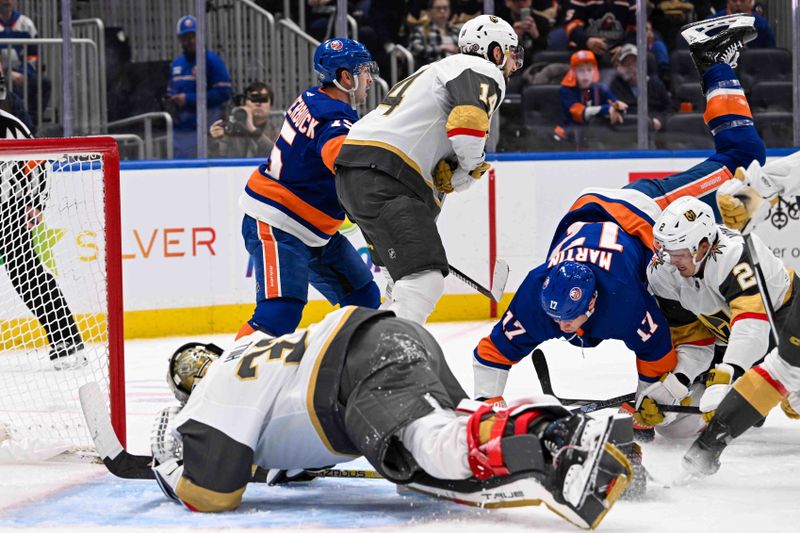 Jan 23, 2024; Elmont, New York, USA;  New York Islanders left wing Matt Martin (17) flips over Vegas Golden Knights defenseman Zach Whitecloud (2) during the second period at UBS Arena. Mandatory Credit: Dennis Schneidler-USA TODAY Sports