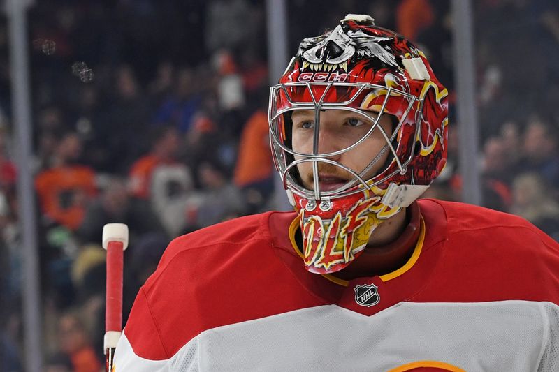 Mar 4, 2025; Philadelphia, Pennsylvania, USA; Calgary Flames goaltender Dustin Wolf (32) against the Philadelphia Flyers during the third period at Wells Fargo Center. Mandatory Credit: Eric Hartline-Imagn Images