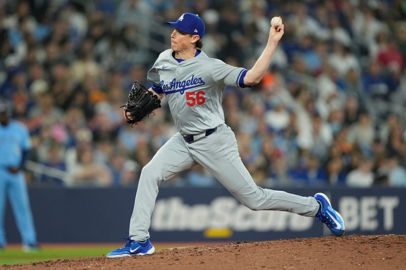 Apr 28, 2024; Toronto, Ontario, CAN; Los Angeles Dodgers pitcher Ryan Yarbrough (56) pitches to the Toronto Blue Jays during the sixth inning at Rogers Centre. Mandatory Credit: John E. Sokolowski-USA TODAY Sports
