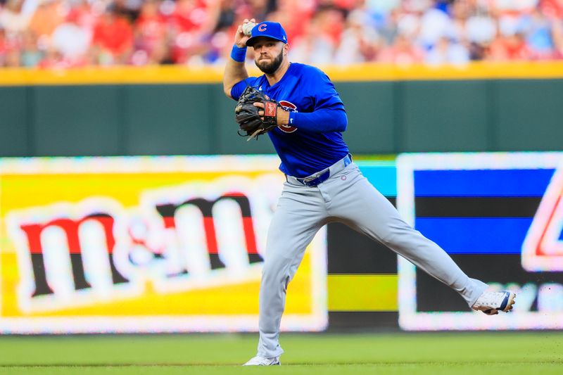 Jun 7, 2024; Cincinnati, Ohio, USA; Chicago Cubs second baseman David Bote (13) throws to first to get Cincinnati Reds first baseman Spencer Steer (not pictured) out in the second inning at Great American Ball Park. Mandatory Credit: Katie Stratman-USA TODAY Sports