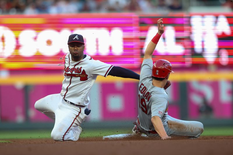 Sep 7, 2023; Atlanta, Georgia, USA; Atlanta Braves second baseman Ozzie Albies (1) tags out St. Louis Cardinals center fielder Tommy Edman (19) on a steal attempt in the first inning at Truist Park. Mandatory Credit: Brett Davis-USA TODAY Sports
