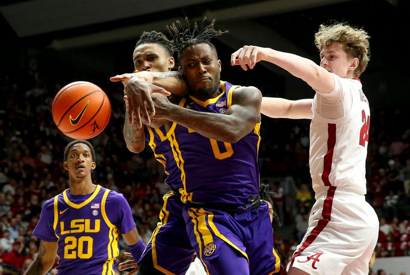 Jan 27, 2024; Tuscaloosa, Alabama, USA;  LSU guard Trae Hannibal (0) and Alabama forward Sam Walters (24) attempt to rebound at Coleman Coliseum. Mandatory Credit: Gary Cosby Jr.-USA TODAY Sports