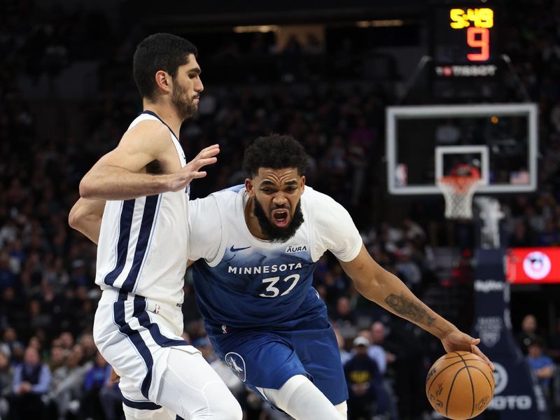 MINNEAPOLIS, MN -  FEBRUARY 28:  Karl-Anthony Towns #32 of the Minnesota Timberwolves drives to the basket during the game against the Memphis Grizzlies on February 28, 2024 at Target Center in Minneapolis, Minnesota. NOTE TO USER: User expressly acknowledges and agrees that, by downloading and or using this Photograph, user is consenting to the terms and conditions of the Getty Images License Agreement. Mandatory Copyright Notice: Copyright 2024 NBAE (Photo by Jordan Johnson/NBAE via Getty Images)