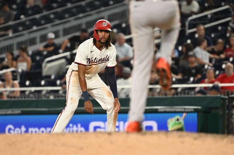 Aug 6, 2024; Washington, District of Columbia, USA; Washington Nationals left fielder James Wood (29) watches San Francisco Giants relief pitcher Taylor Rogers (33) from first base during the sixth inning at Nationals Park. Mandatory Credit: Rafael Suanes-USA TODAY Sports