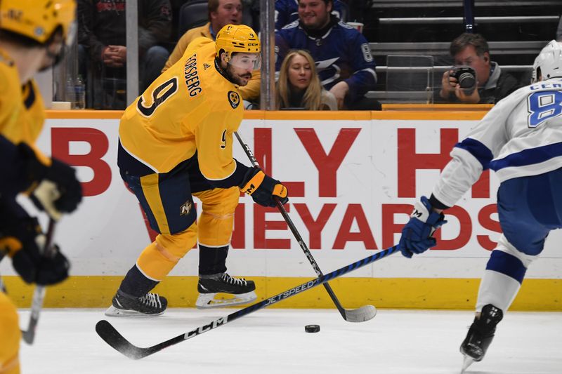 Dec 3, 2023; Nashville, Tennessee, USA; Nashville Predators left wing Filip Forsberg (9) skates the puck into the offensive zone during the first period against the Tampa Bay Lightning at Bridgestone Arena. Mandatory Credit: Christopher Hanewinckel-USA TODAY Sports